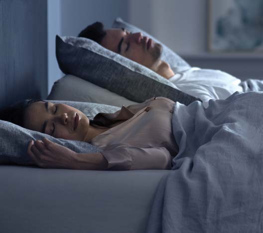 a man and a woman sleeping